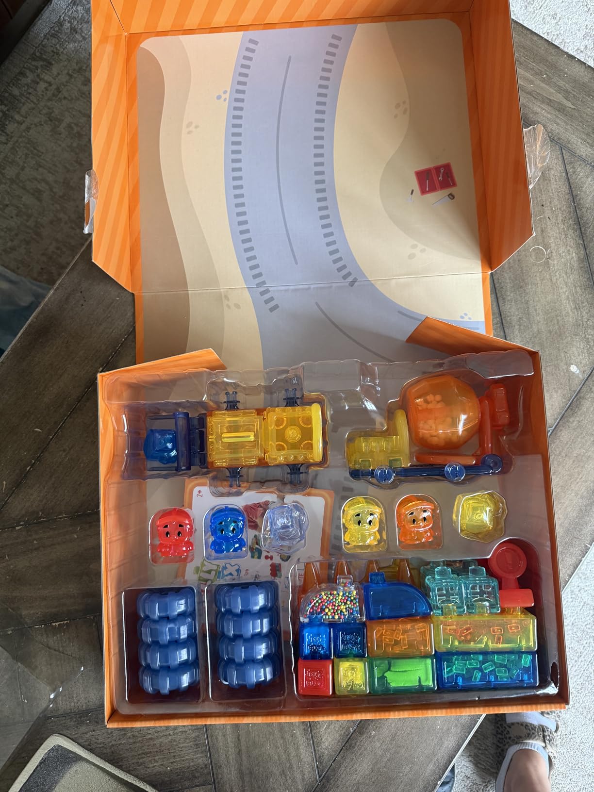 Construction Site box opened to show the dozer, cement mixer, four workers and filled blocks in the tray